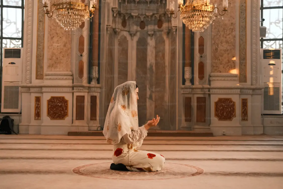 A girl praying and doing Dua